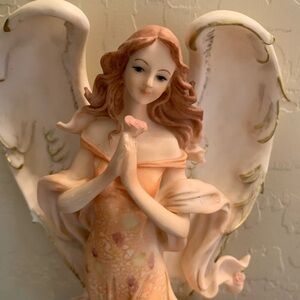 Elegant Seraphim Figurine in Soft Peach Tones Collectible Rose